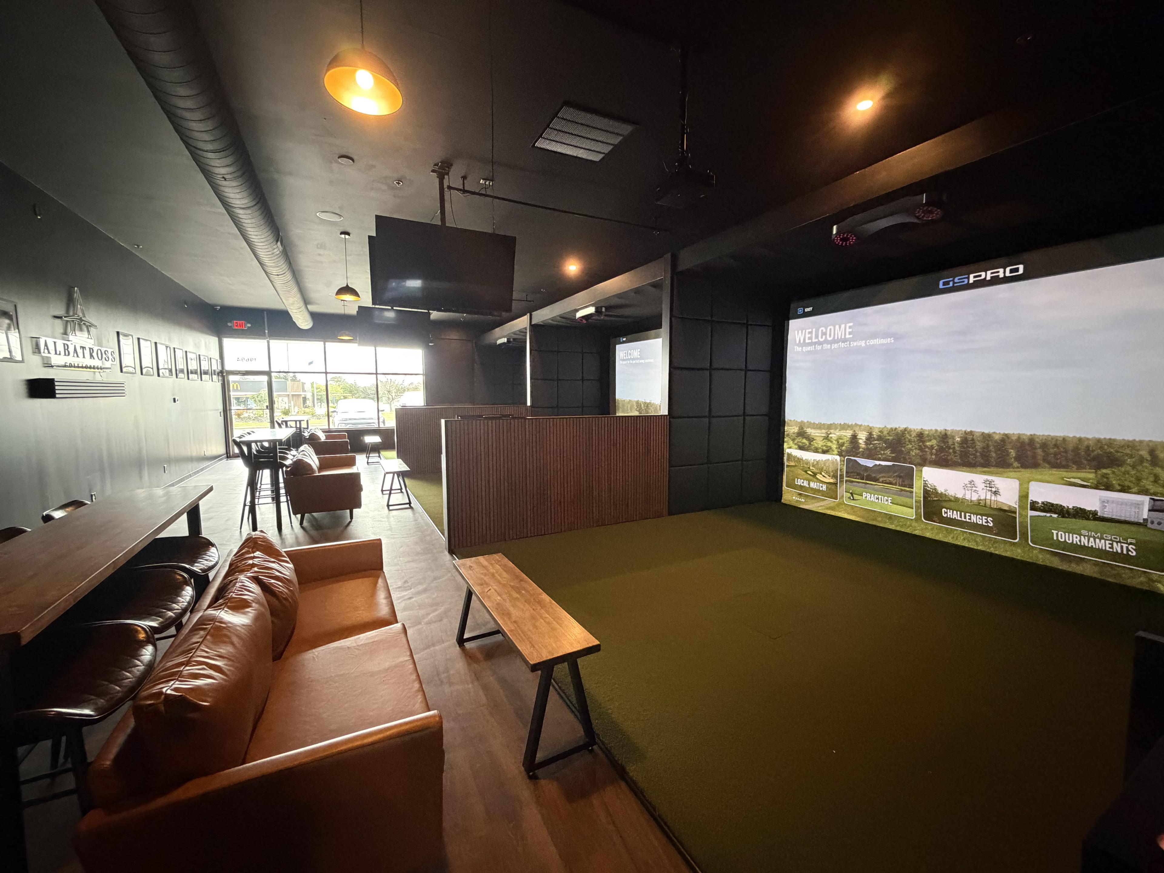 Simulator bays and lounge seating at Albatross Golf Lounge